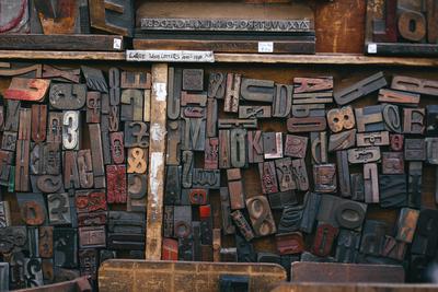A woodytpe printing font. I would say, different shapes of letters carved on wood.