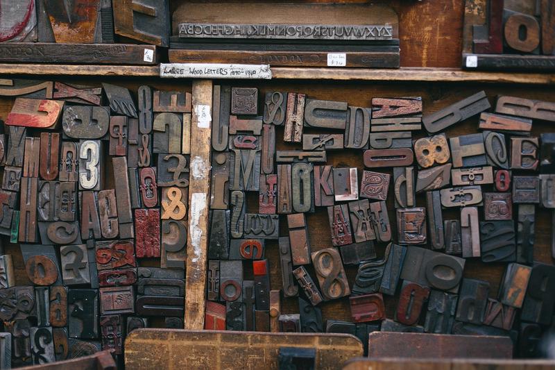 A woodytpe printing font. I would say, different shapes of letters carved on wood.